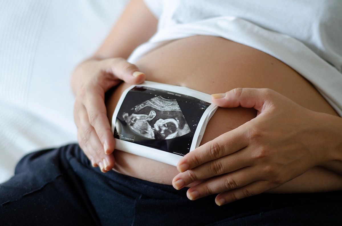 Pregnant woman following successful IVF treatment